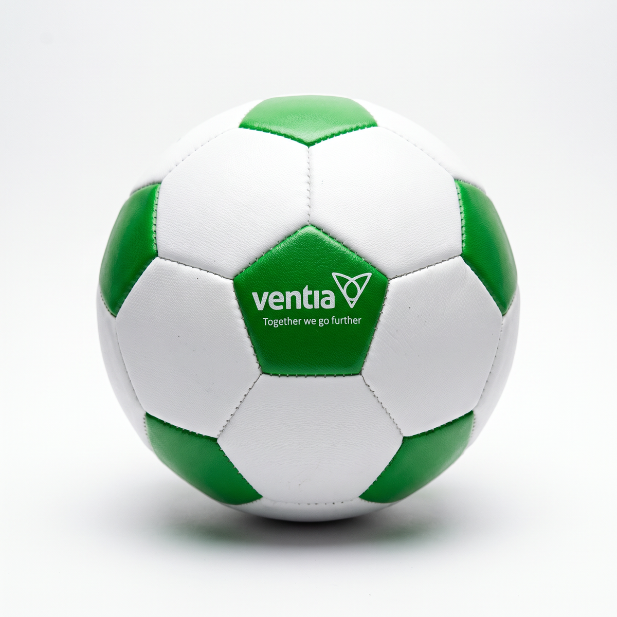 A classic white and green soccer ball with the 'ventia' logo printed on a green panel, photographed on a clean white background.
