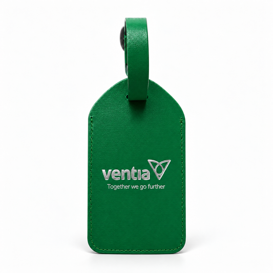 A green leather luggage tag with a matching leather loop handle, featuring the white printed 'ventia' logo and the slogan 'Together we go further' on a clean white background.
